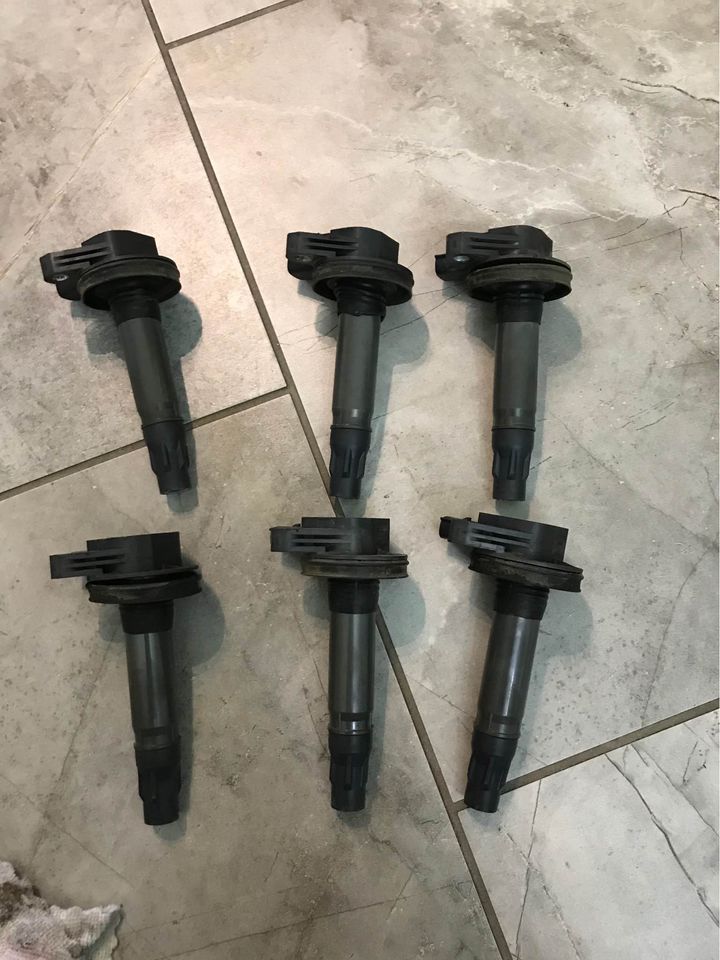 12 bad ignition coil symptoms (& replacement cost)