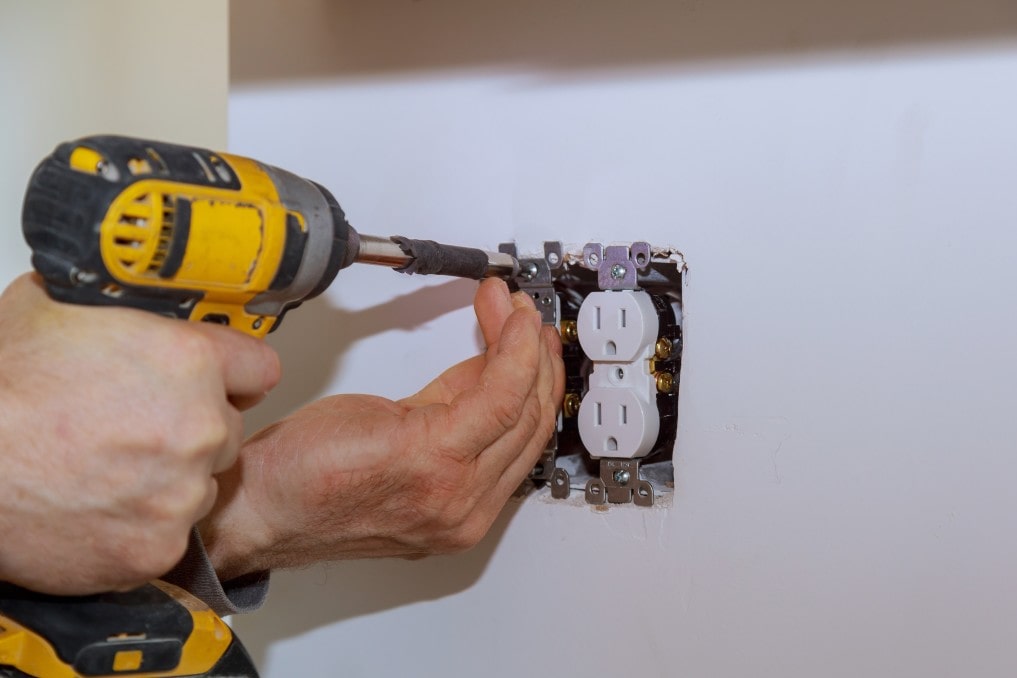 electrician installing an outlet