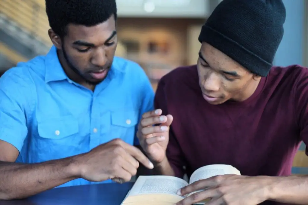teenagers helping each other