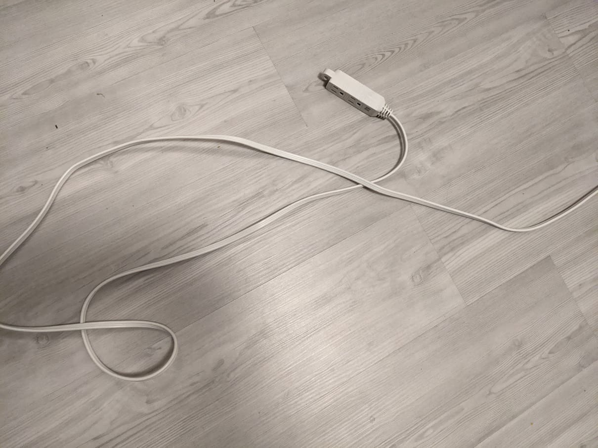 white extension cord on light background